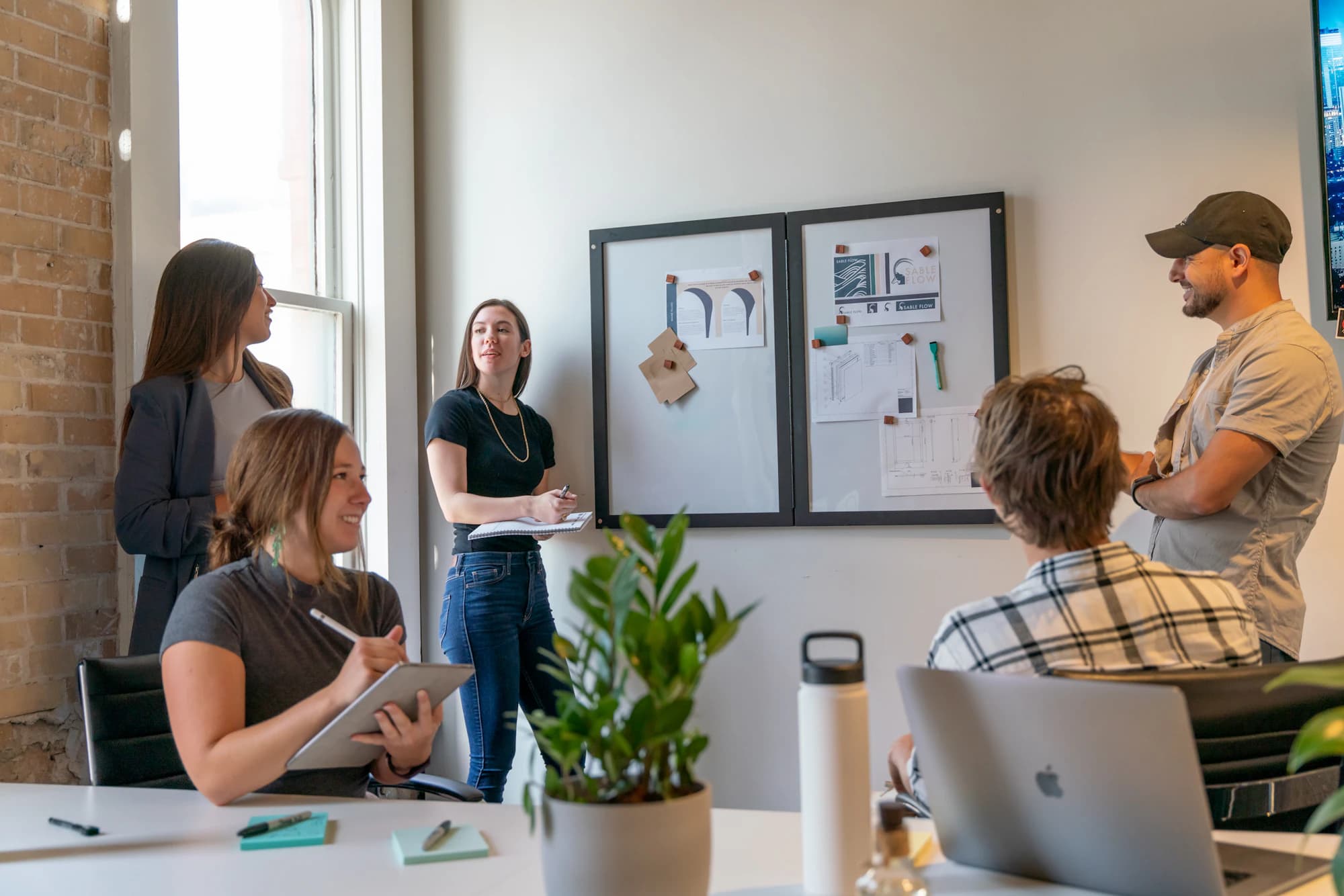 An agency team reviewing a moodboard in their studio